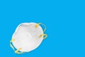 Ear-loop face mask, Safety N95 masks on blue background. dust protection respirator and breathing medical respiratory mask