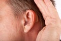 Ear of a man close up with hearing aid. Royalty Free Stock Photo