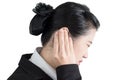 Ear pain symptom in a businesswoman isolated on white background. Clipping path on white background. Royalty Free Stock Photo