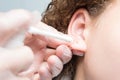 Ear piercing treatment for decoration, close-up