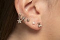 Ear piercings photos.Helix piercing.Ear rings