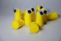 Ear plugs against hearing damage. Yellow plastic puffs in the ear that reduce noise and a quiet night\'s sleep.