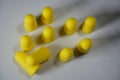 Ear plugs against hearing damage. Yellow plastic puffs in the ear that reduce noise and a quiet night\'s sleep.