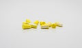 Ear plugs for protection against noise in yellow and white. Royalty Free Stock Photo