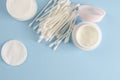 Ear sticks and cotton pads on pastel blue background. Makeup removal and skin care concept. Royalty Free Stock Photo