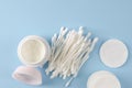 Ear sticks and cotton pads on pastel blue background. Makeup removal and skin care concept. Royalty Free Stock Photo