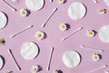 Ear sticks, white cotton pads and chamomiles on a pink background Royalty Free Stock Photo