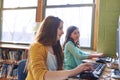 The earlier children begin to use the computer, the better. elementary children working on computers at school. Royalty Free Stock Photo