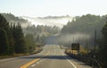 The early autumn morning fog on Highway 60 in Algonquin Park, Canada Royalty Free Stock Photo