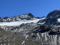 Early autumn remains of the alpine glacier Vardet da Grialetsch in the Albula Alps mountain massif, Zernez