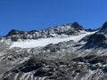 Early autumn remains of the alpine glacier Vardet da Grialetsch in the Albula Alps mountain massif, Zernez