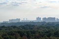 Early blue dawning over urban park and city