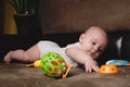 6 month old Caucasian infant baby boy playing with plastic toys. Early childhood development. Royalty Free Stock Photo