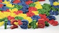 Early Childhood Education , Colorful plastic one to ten number sets in Red, Blue, Green and Yellow colors. in white background. Royalty Free Stock Photo