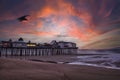 Early dawn morning on the ocean. An old wooden pier with houses Royalty Free Stock Photo