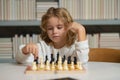 Early development. Boy thinking about chess. The concept of learning and growing children. Chess, success and winning. Royalty Free Stock Photo