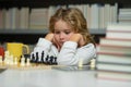 Early development. Child thinking about chess. The concept of learning and growing children. Chess, success and winning. Royalty Free Stock Photo