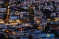Early evening aerial view of rolling San Francisco Hills showing rooftops and city streets