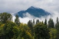 Early fall color among cloud shrouded mountains in Pacific Northwest