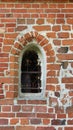 Early gothic window in a small country church, Gothic red brick architecture in the Baltics