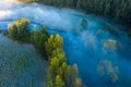 Early morning above misty river and forest