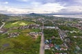 Early morning aerial of the Pan-Philippine highway with the city of Tacloban in the distance Royalty Free Stock Photo