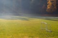 Early morning in the amatuer soccer field. Football game playground in autumn foggy morning. Early morning in the amatuer soccer Royalty Free Stock Photo