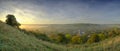 Early morning autumnal mist over East Meon village with Butser Hill and the South Downs in the background, South Downs National