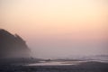 Early morning, beach, sea, people, seagulls, fog Royalty Free Stock Photo