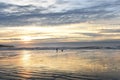 Early morning on the coast of the Atlantic Ocean. Woman doing jogging with a dog. Royalty Free Stock Photo