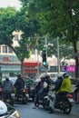 Early morning commuters at green light in Hanoi Vietnam