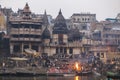 Early morning cremations take place at the ghats along the holy river Ganges in Varanasi, Benares, India Royalty Free Stock Photo