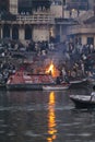 Early morning cremations take place at the ghats along the holy river Ganges in Varanasi, Benares, India