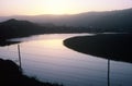 Early Morning curved lake with fence Royalty Free Stock Photo