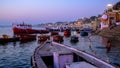 Early morning dawn scenes Blue Hour, by the Ghats of the River Ganga in Varanasi, Uttar Pradesh, India.