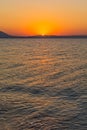 Early morning , dramatic sunrise over sea and mountain. Photographed in Asprovalta, Greece. Royalty Free Stock Photo