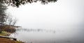 Early morning fog on a lake near Ottawa, Ontario. Royalty Free Stock Photo