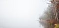 Early morning fog on a lake near Ottawa, Ontario. Royalty Free Stock Photo