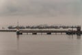 Early morning fog over fleet of fishing vessels, Puerto Nuevo, Lima, Peru Royalty Free Stock Photo