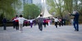 In the early morning, a group of Chinese elderly people who spontaneously gather to exercise.