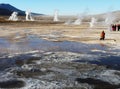 Tourists on the high mountain field of El Tatio geysers