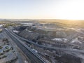 Early morning high angle aerial drone view of a big open pit silver, zinc and lead mine orebody called line of lode