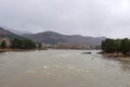 Early morning on the Katun river, Altai. The river at dawn against the backdrop of the mountains, stones on the banks of the river Royalty Free Stock Photo