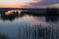 Beautiful sunset with purple clouds on the lake