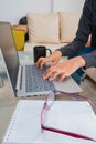 Early in the morning a Latino business girl wakes up and works with a laptop