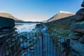 Early morning light and shadow over mountains and snow, gate and stone path in foreground. Carnedd Llewelyn. Landscape Royalty Free Stock Photo