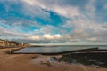 Early morning at Margate beach and tidal swimming pool, Kent with blue cloudy sky Royalty Free Stock Photo