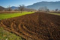 Early morning in the mountains, field and fog Royalty Free Stock Photo