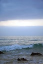 Early morning over the Atlantic ocean. Before sunrise. Surf waves and horizon. Vertical shot. Royalty Free Stock Photo