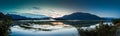 Early morning panorama of marshlands and mountain range